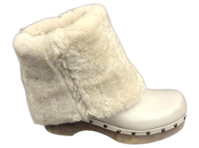 Zoccoli Frye in pelle e shearling crema
