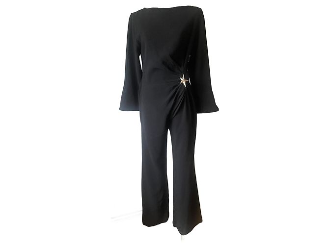 Tuta nera Thierry Mugler con spilla a stella Nero