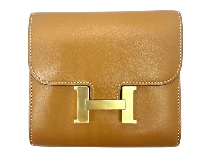 Monedero compacto Constance de Hermès Dorado
