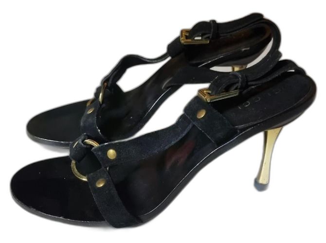 Gucci High Heels aus schwarzem Leder mit goldenem Absatz