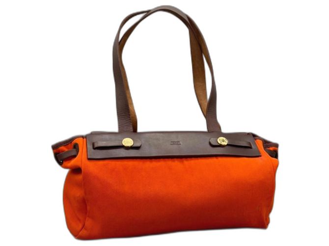 Hermès Son sac en cuir toile orange Marron