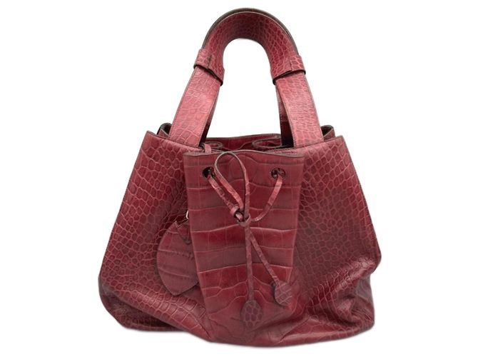 Alaïa Bolsa tote de couro com estampado de crocodilo