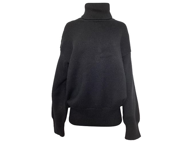 The row Der Rollkragenpullover aus schwarzer Merinowolle 