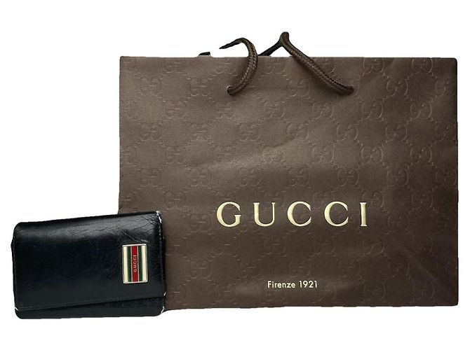 Bolsa de couro preto entrelaçado Gucci
