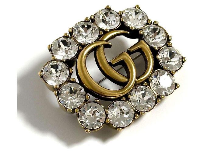 Broche em metal Double G da Gucci para mulheres com cristais