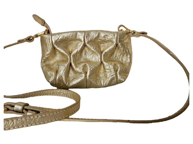 Autre Marque Mini bolsa de couro dourado