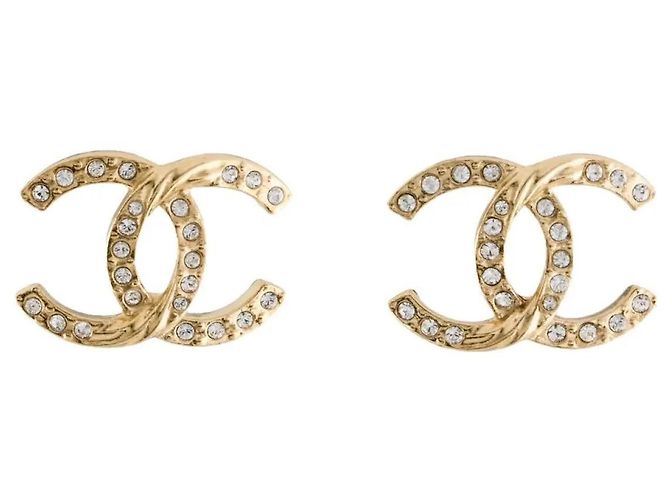 Orecchini Chanel in metallo dorato e strass D'oro
