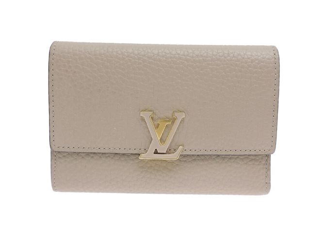 Billetera compacta bi-fold Capucines de Louis Vuitton Castaño