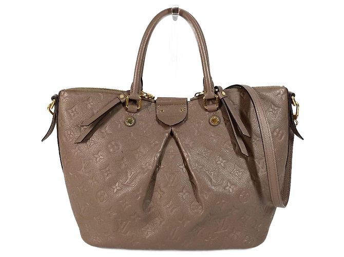Bolsa Motherine MM em Monogram Empreinte Louis Vuitton Bege