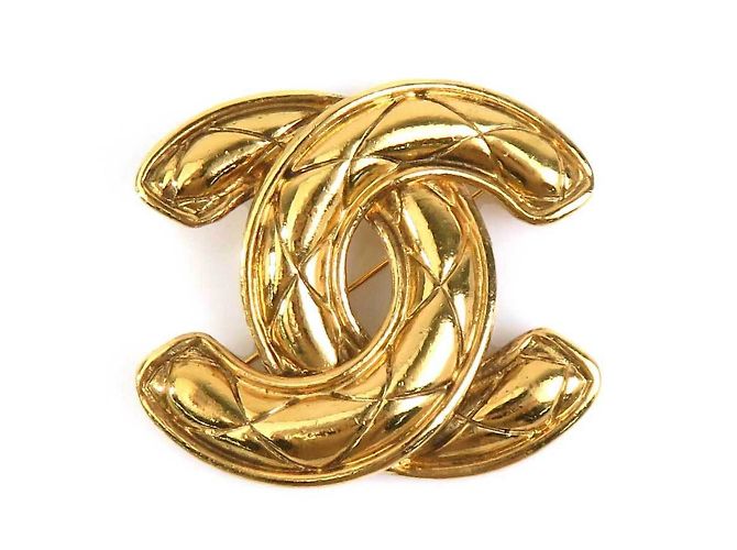 Spilla in metallo dorato Chanel D'oro