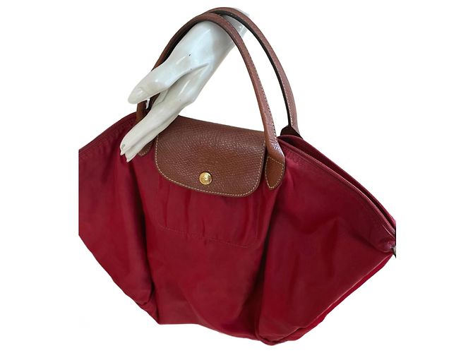 Pliage Red Longchamp bag with brown leather details Dark red
