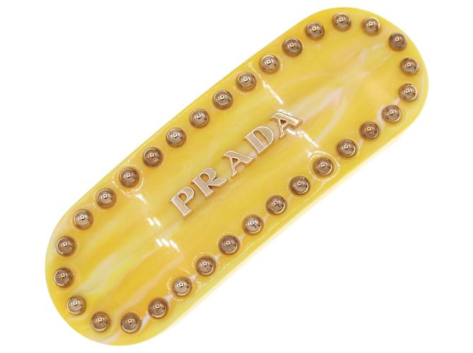 Clipe de cabelo amarelo Prada