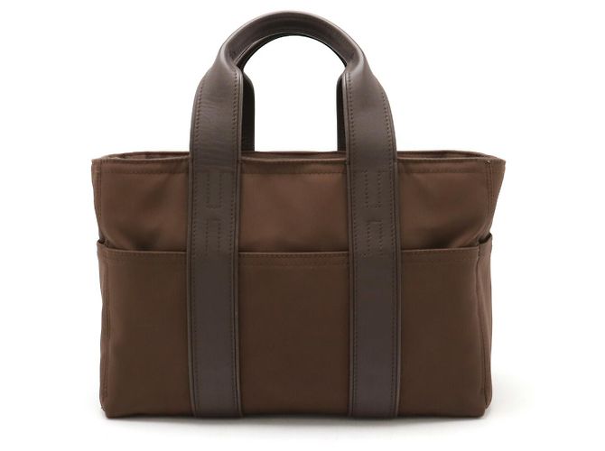 Bolsa tote de nylon e couro Hermès Acapulco Marrom