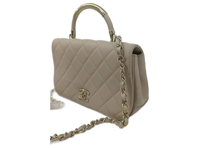 Bolsa de mão Chanel Coco Handle em couro bege