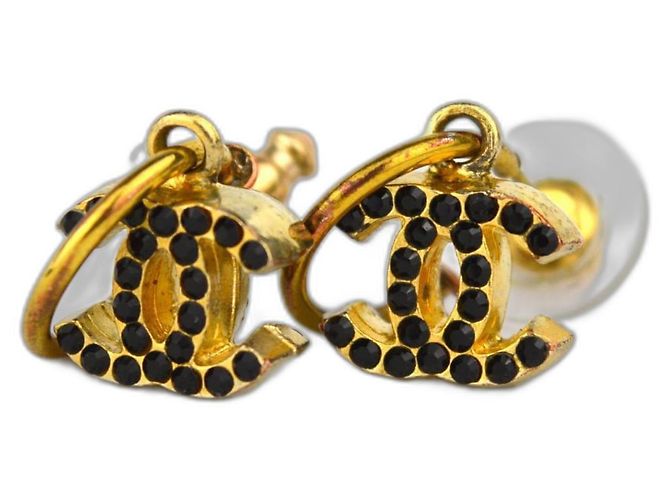 Boucles d'oreilles Chanel CC dorées et pierre noire