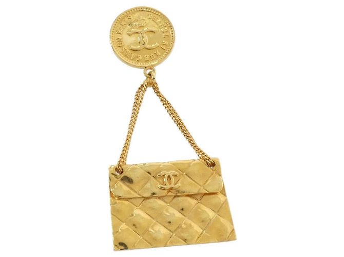 Broche Chanel dorado