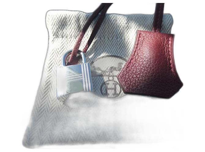 Hermès togo leather bell, pull tab, and lock in red, brand new with dustbag 