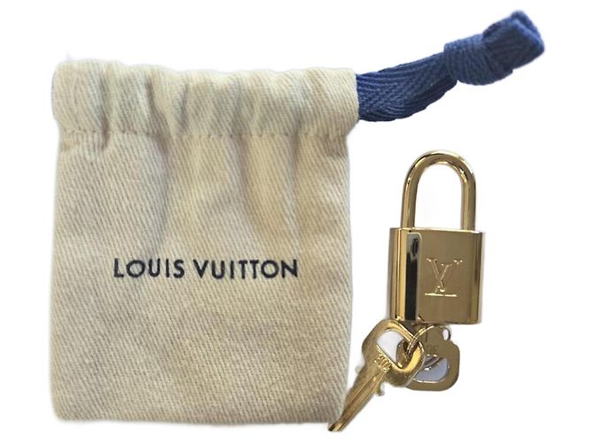 Cadenas doré Louis Vuitton N°304
