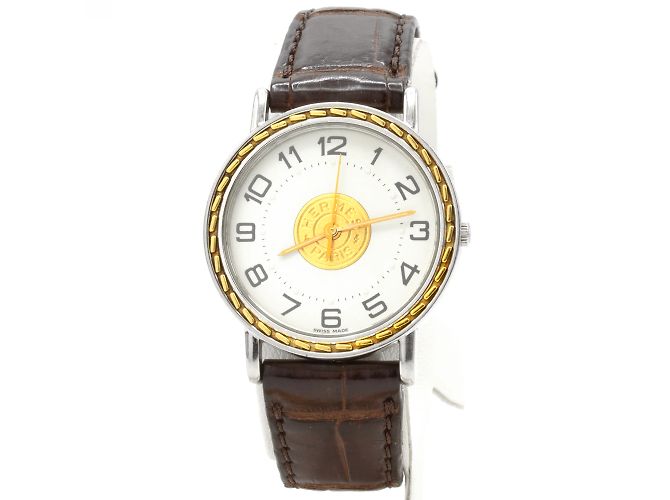 Reloj Sellier de Hermès. Dorado