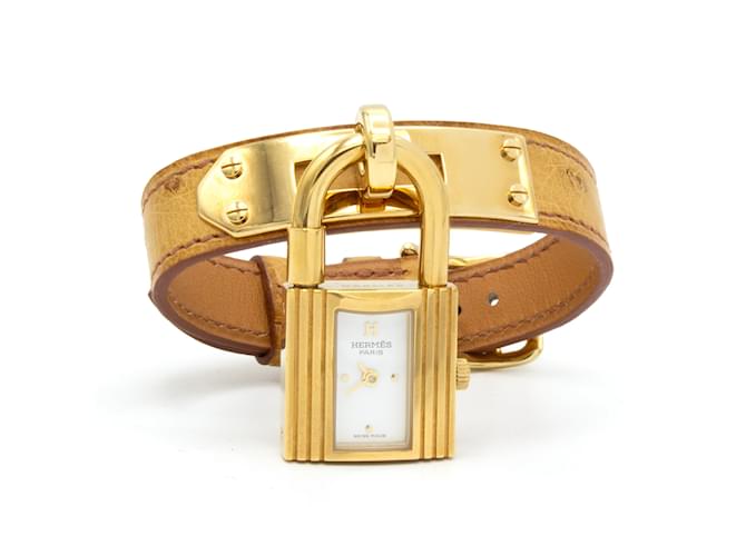 Reloj Hermès Kelly chapado en oro con correa de cuero de avestruz Dorado 