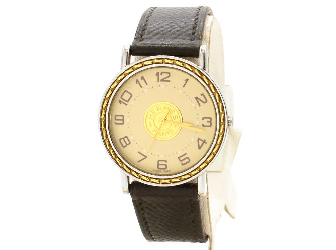 Reloj Sellier de Hermès. Dorado