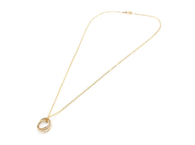 Collier Trinity de Cartier. Doré
