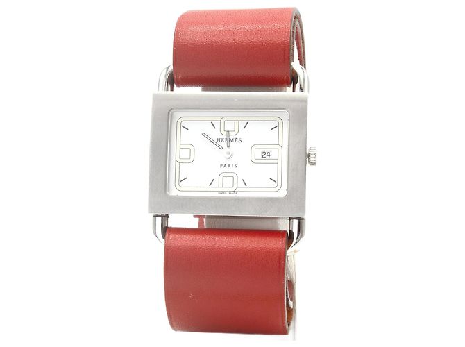e um relógio Hermès original. Prata