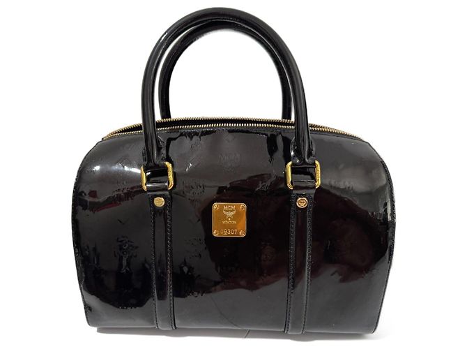 Bolsa Boston MCM em couro patente preto e dourado Gold hardware