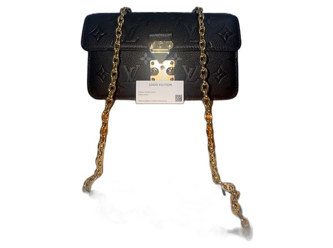 Borsa Louis Vuitton in pelliccia dorata D'oro