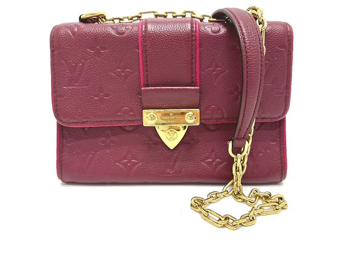 Bolso de cadena Saint-Sulpice PM en Monogram Empreinte Louis Vuitton Roja