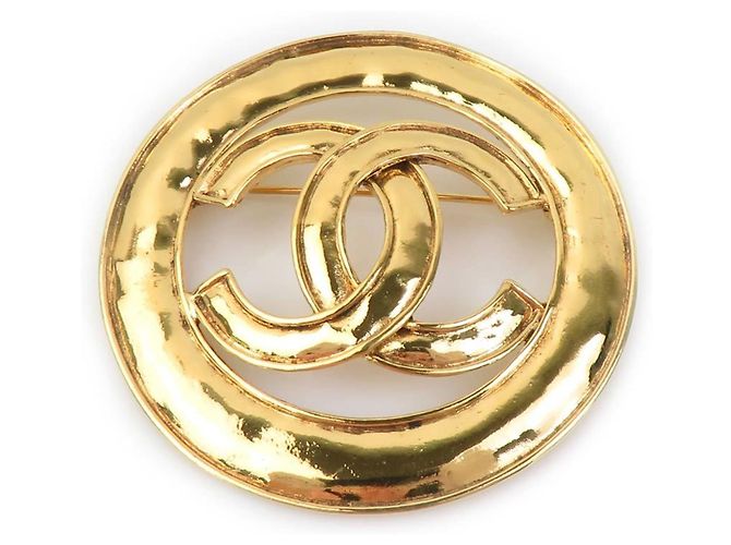 Spilla in metallo dorato Chanel Coco Mark D'oro