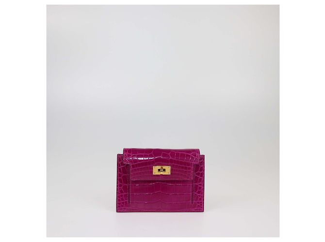 Cartera compacta Kelly de cocodrilo Rose Scheherazade de Hermès