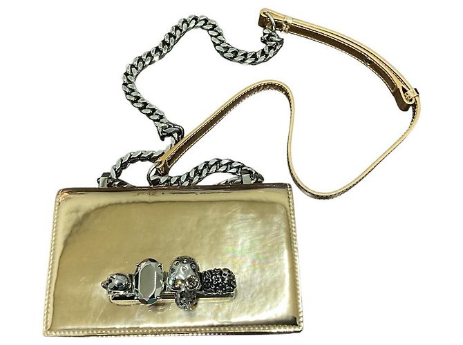 Borsa Alexander McQueen in pelle metallizzata oro con knuckle argento D'oro