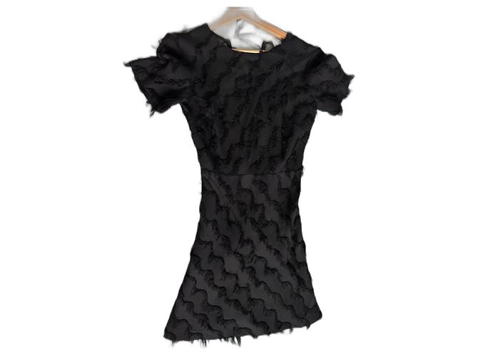 Mini vestido Sandro de seda con flecos negro