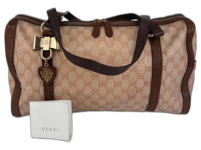 Bolsa de ombro Gucci em lona e couro marrom 261