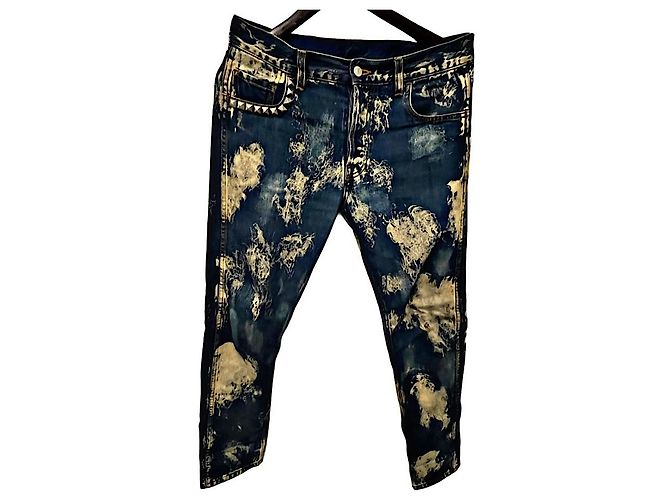 Jeans Gucci in denim blu con borchie ed effetto usurato