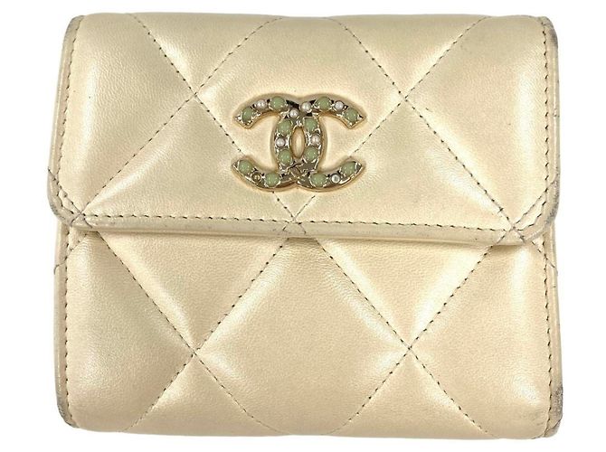 CHANEL Matelasse Tri-fold Wallet in White Lambskin
