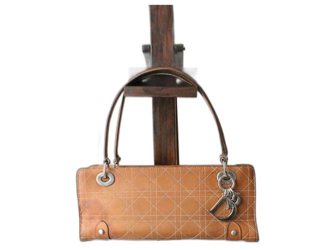 Dior Lady Dior model in camel leather with white stitching