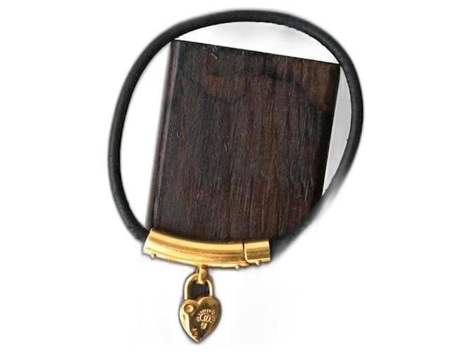 Pulsera Hermès con charm de corazón y candado en metal dorado Negro 
