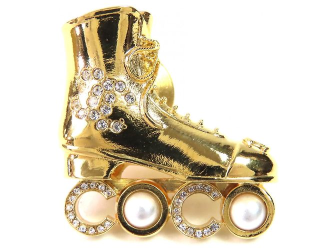 Chanel Coco Rollschuh Brosche Golden