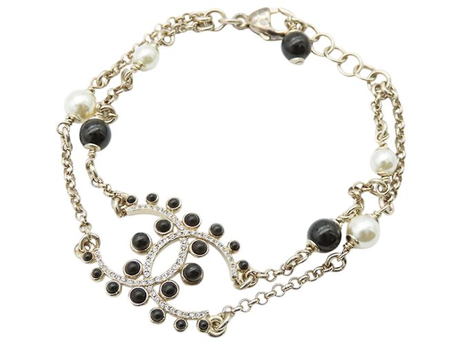 Pulsera de perlas falsas y strass CC chapada en oro Chanel