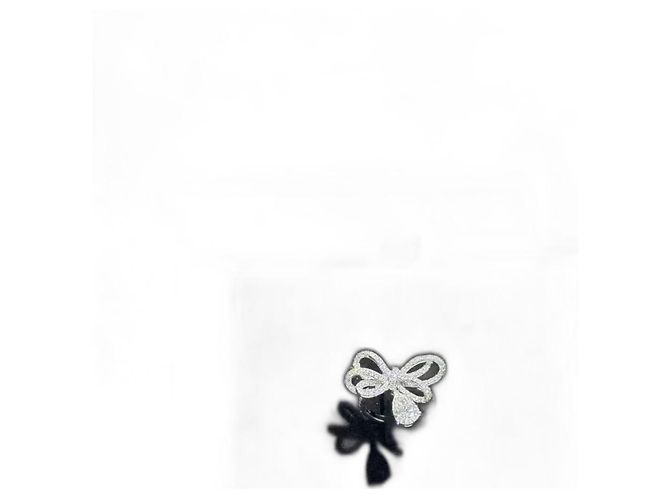 Bague nœud en diamant Ruban Chanel en or 18K 1ct Argenté