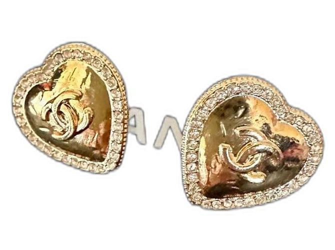 Boucles d'oreilles Chanel dorées en acier