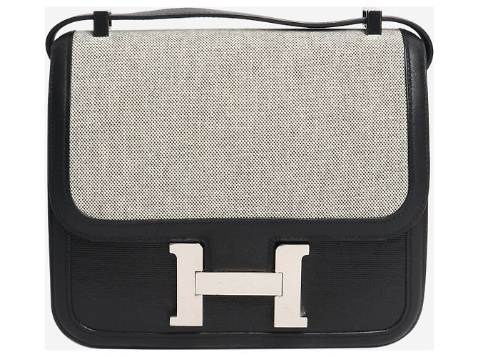 Hermès Constance de lona y cuero negro