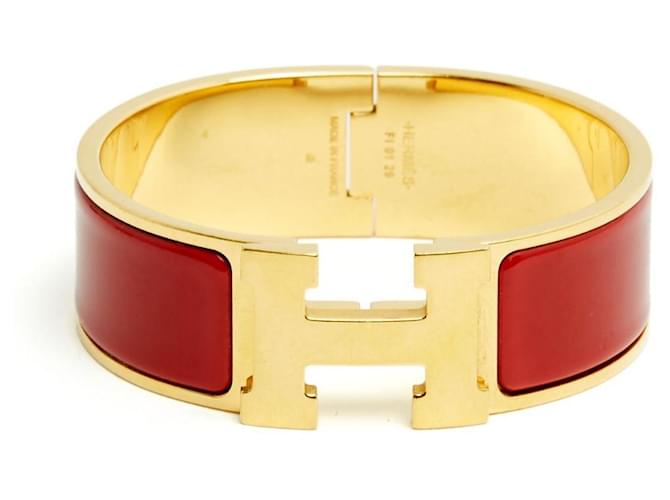 Hermès Golden Red Clic Clac H Bracelet
Golden Metal Red Enamel Bracelet Hermes 
