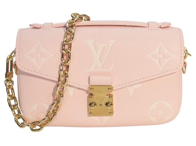 Bolsa de couro rosa pó Monogram Empreinte Giant Pochette Métis da Louis Vuitton