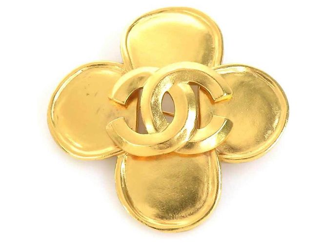Broche de metal dorado Chanel Coco Mark