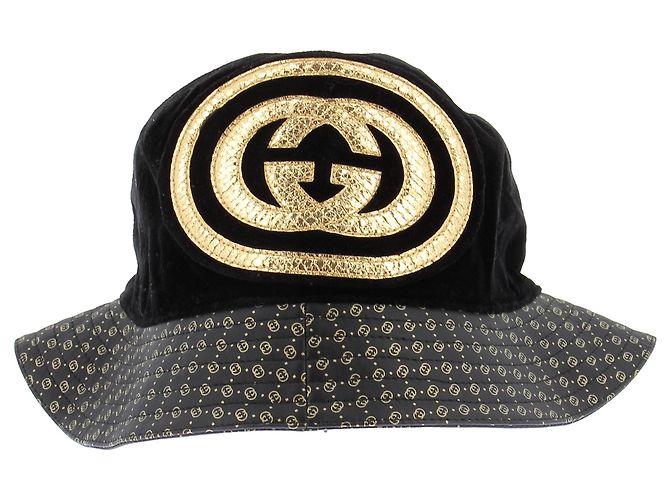 Cappello bucket Gucci nero e oro
