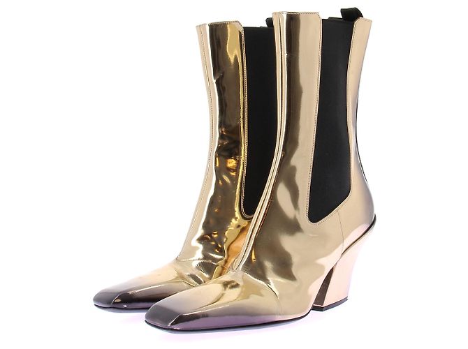 Prada Botas pretas e douradas Dourado