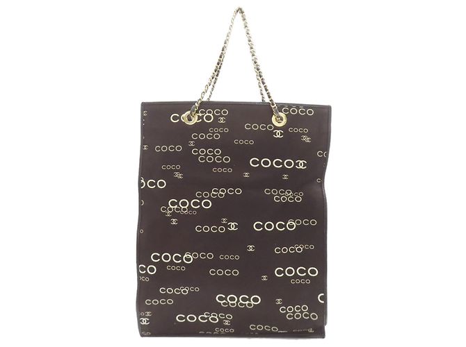 Bolsa tote de lona com estampa COCO e hardware dourado Chanel Preto